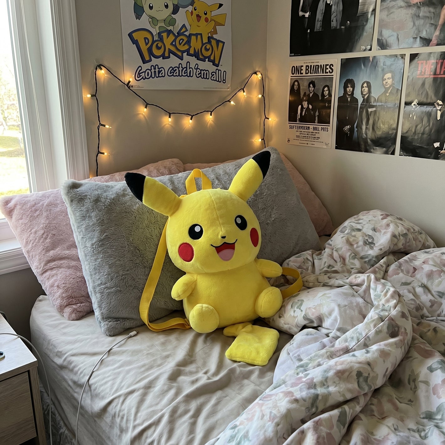 Pokemon plush bag on a customer bed