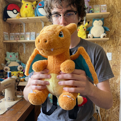 Charizard plush bag held in hands