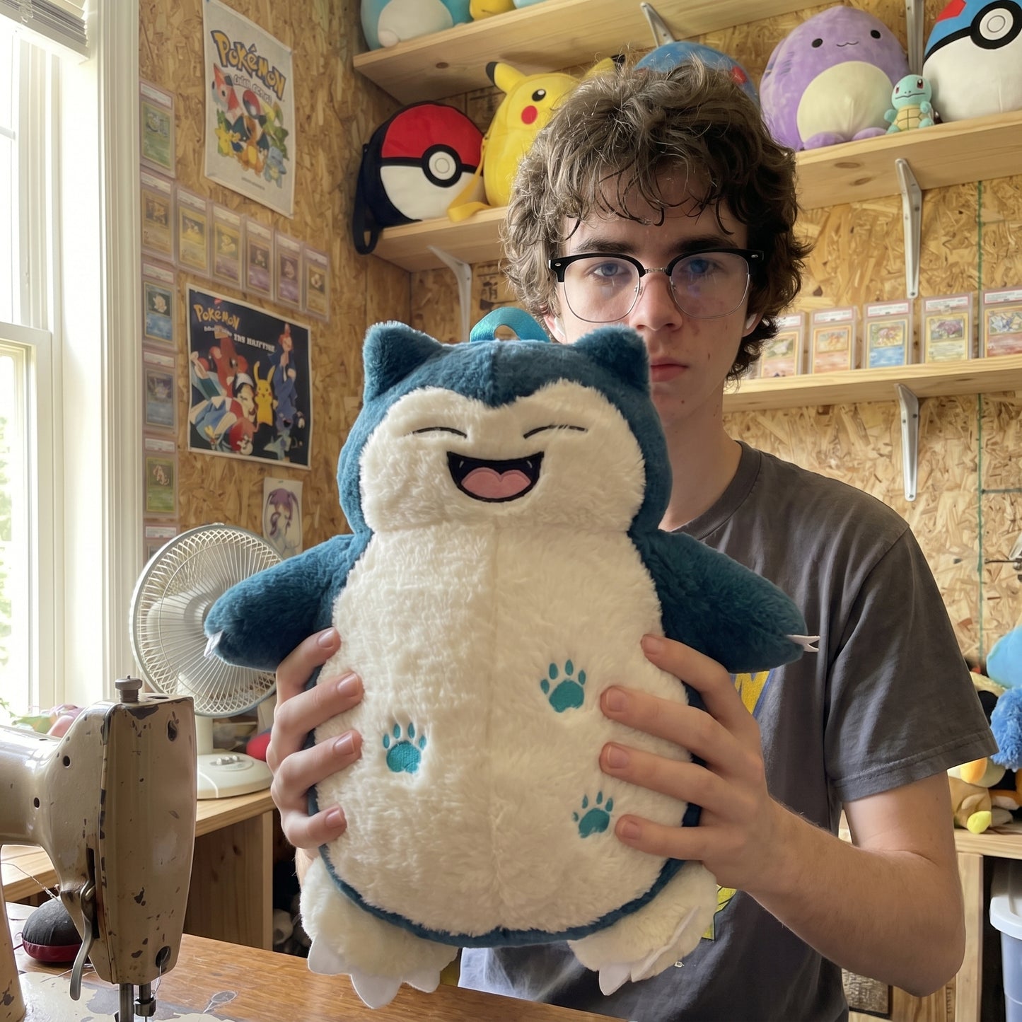 Snorlax plush backpack held in hands