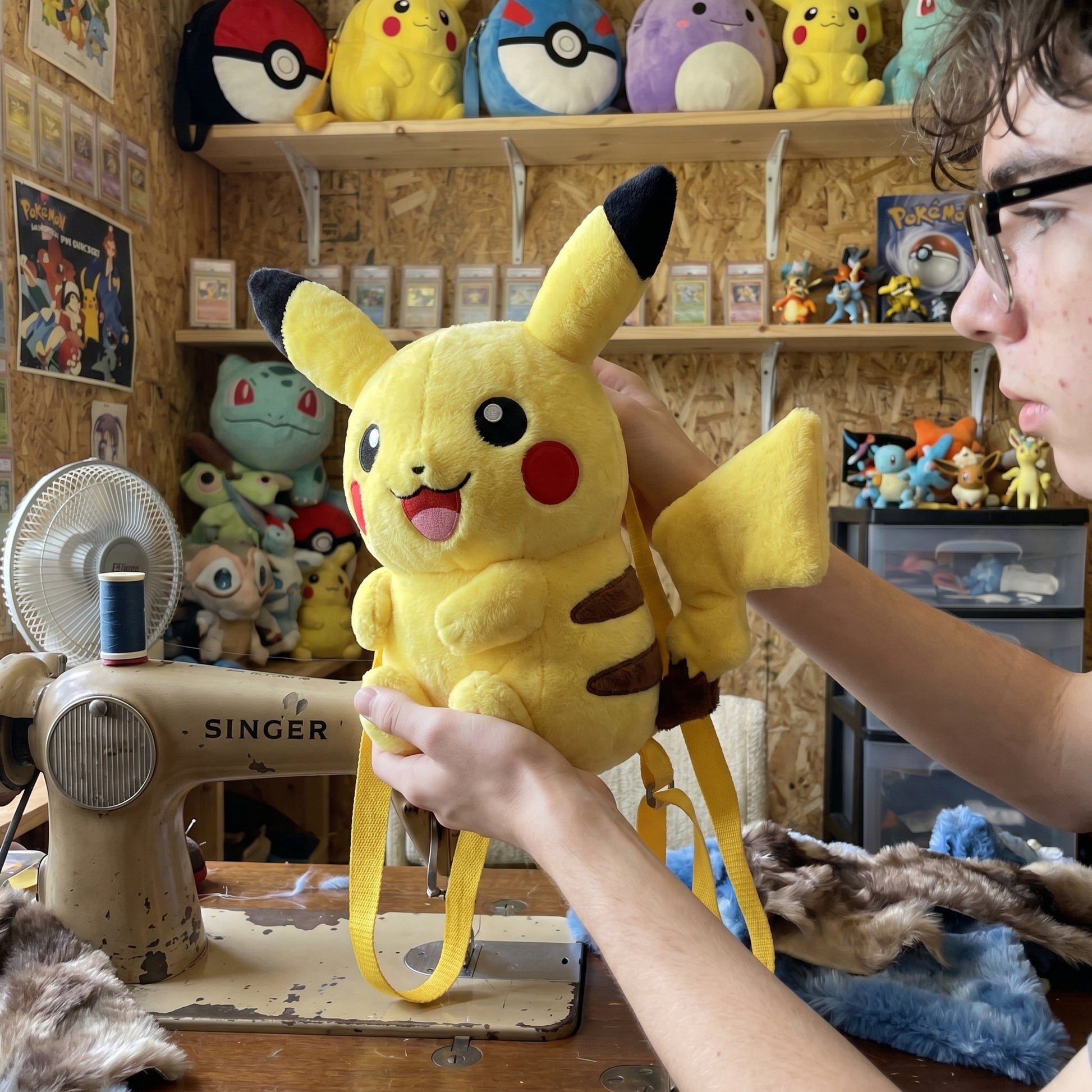 Pikachu plush backpack held in hands