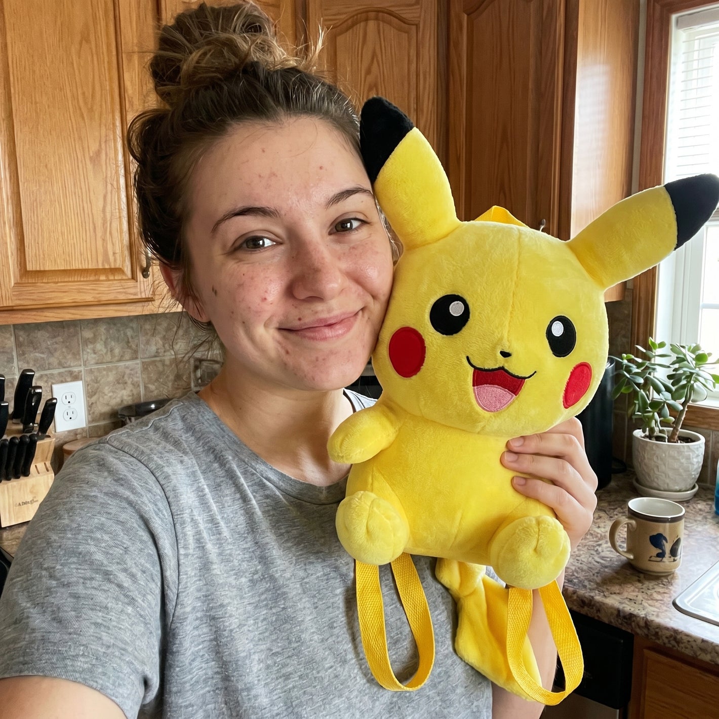 Happy customer holding her Pokemon plush bag