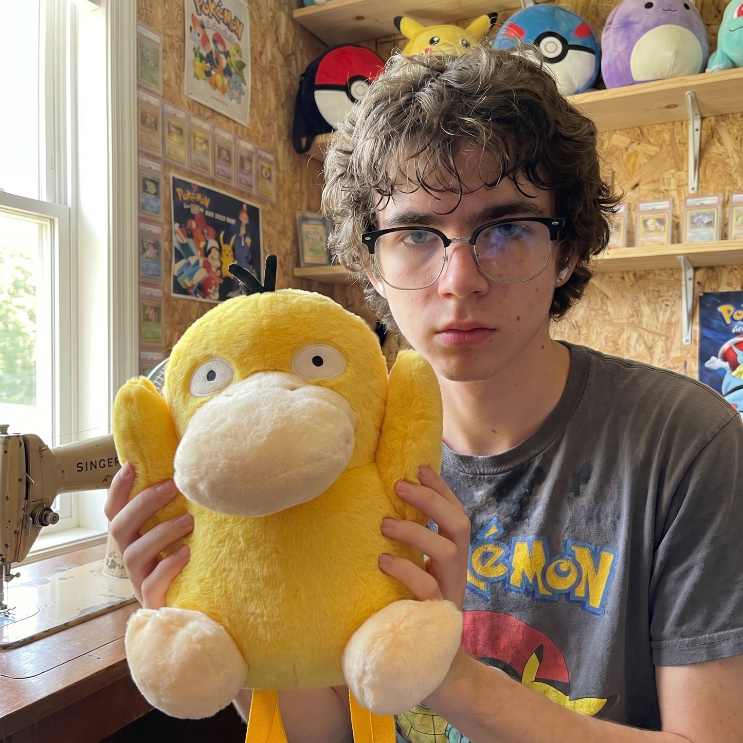 Psyduck plush bag held in hands
